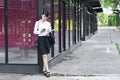 Beautiful Asian business woman calling mobile phone. Royalty Free Stock Photo