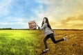 Beautiful asian business woman running with briefcase over climate change background Royalty Free Stock Photo