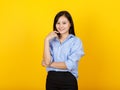 Beautiful Asian business woman secretary on smart executive dress style of long sleeve shirt smile and happy to relax by putting Royalty Free Stock Photo