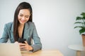 Beautiful asian business woman using smartphone working in office Royalty Free Stock Photo