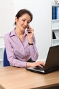 Beautiful Asian business woman using telephone Royalty Free Stock Photo