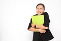 Beautiful Asian business woman wearing black suit holding document folder and happy with success something on  white background Royalty Free Stock Photo