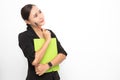 Beautiful Asian business woman wearing black suit holding document folder and pen and thinking something on  white background and Royalty Free Stock Photo