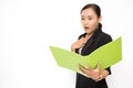 Beautiful Asian business woman wearing black suit look at document folder and shocked with something on white background and copy Royalty Free Stock Photo