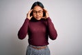 Beautiful asian business woman wearing casual sweater and glasses over white background with hand on head for pain in head because Royalty Free Stock Photo