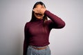 Beautiful asian business woman wearing casual sweater and glasses over white background smiling and laughing with hand on face Royalty Free Stock Photo