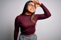 Beautiful asian business woman wearing casual sweater and glasses over white background very happy and smiling looking far away Royalty Free Stock Photo