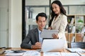 A beautiful Asian businesswoman is discussing work, analyzing business financial data Royalty Free Stock Photo