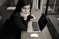 Beautiful businesswoman got stress and headache with laptop computer on table Royalty Free Stock Photo