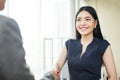 Beautiful Asian businesswoman smiling and shaking hands Royalty Free Stock Photo