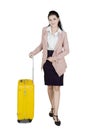 Beautiful Asian businesswoman with yellow suitcase Royalty Free Stock Photo