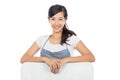 Beautiful Asian cafe owner holding blank white board Royalty Free Stock Photo