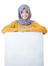 Beautiful Asian cafe owner holding blank white board Royalty Free Stock Photo