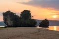 Asian colorful sunset landscape on Napparat Thara beach with cliffs on coast in Krabi province in Thailand