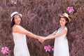 Beautiful Asian couple LGBT women spent time together in park  homosexual announcement relationship in wedding dress for social Royalty Free Stock Photo