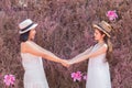 Beautiful Asian couple LGBT women spent time together in park  homosexual announcement relationship in wedding dress for social Royalty Free Stock Photo