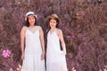 Beautiful Asian couple LGBT women spent time together in park homosexual announcement relationship in wedding dress for social