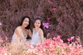 Beautiful Asian couple with wedding dress LGBT women spent time together in park  homosexual announcement relationship for social Royalty Free Stock Photo