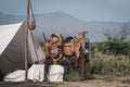 Beautiful Asian cowboy who takes care of her gun and horse with love while at the camp