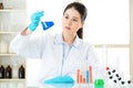 Beautiful asian female chemist braving new medical frontiers Royalty Free Stock Photo