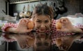 Beautiful asian female farme showing eggs with smile in kitchen Royalty Free Stock Photo