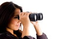 Beautiful asian female looking through binocular