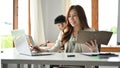 Beautiful asian female secretary working at her office desk Royalty Free Stock Photo