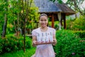 Beautiful asian female spa worker at the spa reception area holding tray with cosmetic product Royalty Free Stock Photo