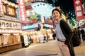 Beautiful asian female standing in the street.