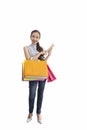 Beautiful asian girl carrying shopping bags. Shopping woman smiling. Beautiful Asian girl. young shopper Royalty Free Stock Photo