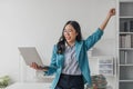 Beautiful Asian girl celebrate with laptop, success happy pose. E-commerce, university education, internet technology Royalty Free Stock Photo