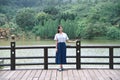 Beautiful Asian girl dressed in traditional elements dress showing herself