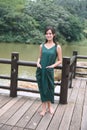 Beautiful Asian girl dressed in traditional elements dress showing herself