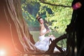 Beautiful Asian girl in a wedding dress showing happy moments