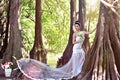 Beautiful Asian girl in a wedding dress showing happy moments