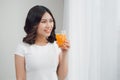 Beautiful asian girl drinking a glass of orange juice. Royalty Free Stock Photo