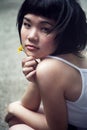 Beautiful Asian girl with a flower Royalty Free Stock Photo