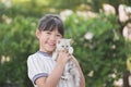 Beautiful Asian girl holding Lovely kitten