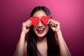 Beautiful asian girl holding red heart cover her eyes Royalty Free Stock Photo