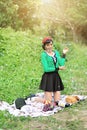 Beautiful Asian girl picnicking outdoors