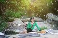 Beautiful Asian girl picnicking outdoors
