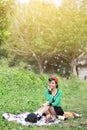 Beautiful Asian girl picnicking outdoors Royalty Free Stock Photo