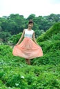 Beautiful asian girl playing in the grass