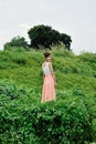 Beautiful asian girl playing in the grass