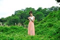 Beautiful asian girl playing in the grass