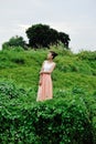 Beautiful asian girl playing in the grass