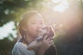 Beautiful asian girl playing with siberian husky puppy in the pa Royalty Free Stock Photo