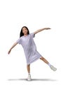 Beautiful Asian girl stand on one leg and arms outstretched on white background. Full body image with clipping path Royalty Free Stock Photo