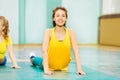 Beautiful Asian girl stretching in sports hall Royalty Free Stock Photo