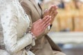 Beautiful Asian girl to pay respect and praying Buddhism worshiping Buddha statue with faith. Hands begging, put your hands togeth Royalty Free Stock Photo